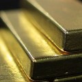 Why does gold go down when dollar goes up?