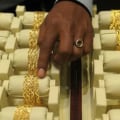 How is a strong dollar affect gold price?